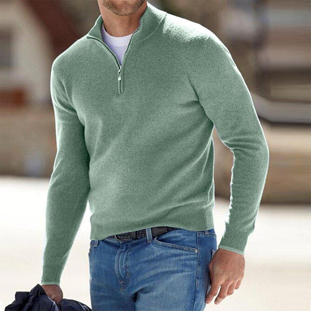 Sage green quarter-zip jumper worn with blue jeans, men's knitted top