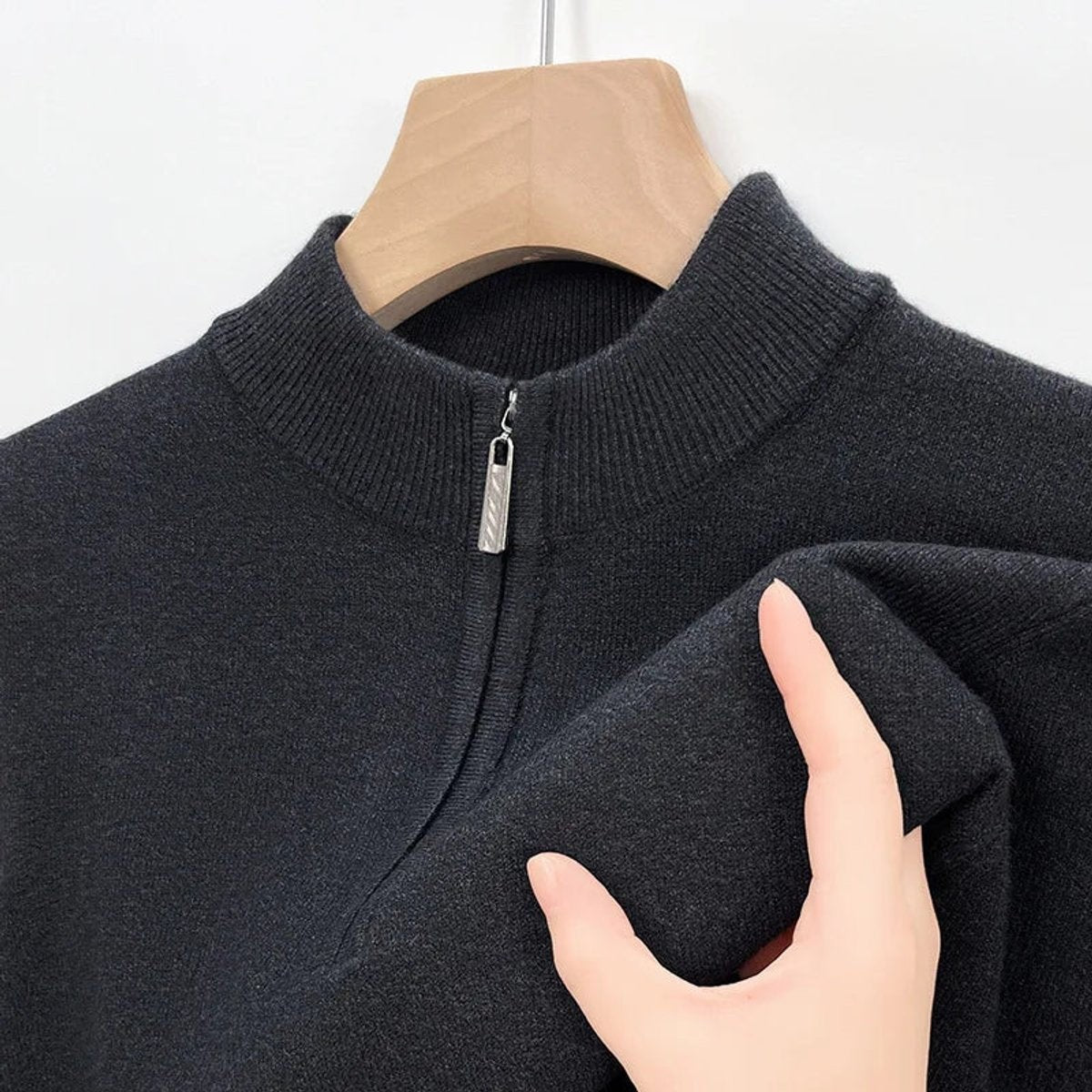 Dark charcoal knitted jumper collar with zip pull and fabric texture detail