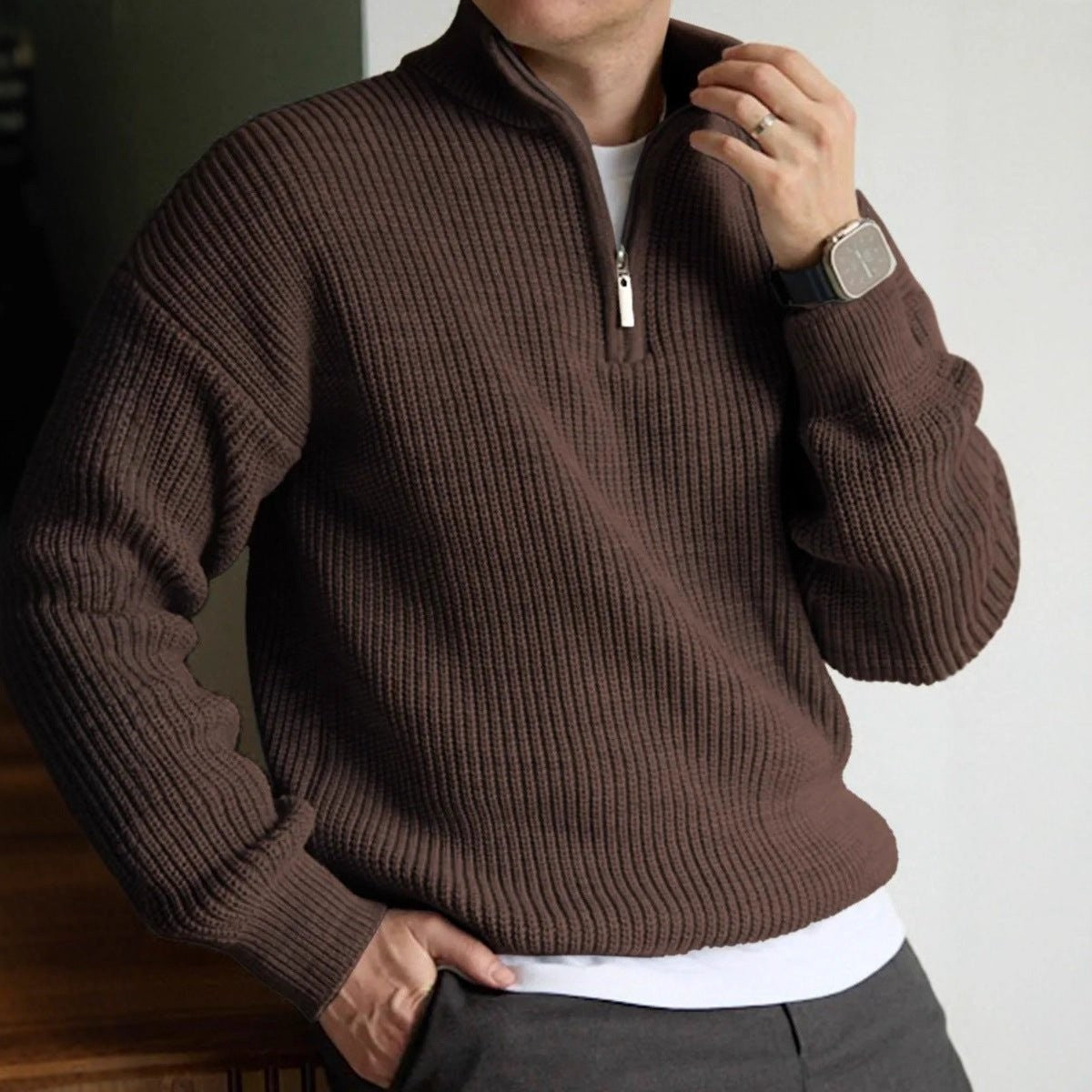 Brown ribbed quarter-zip jumper worn with white tee and grey trousers