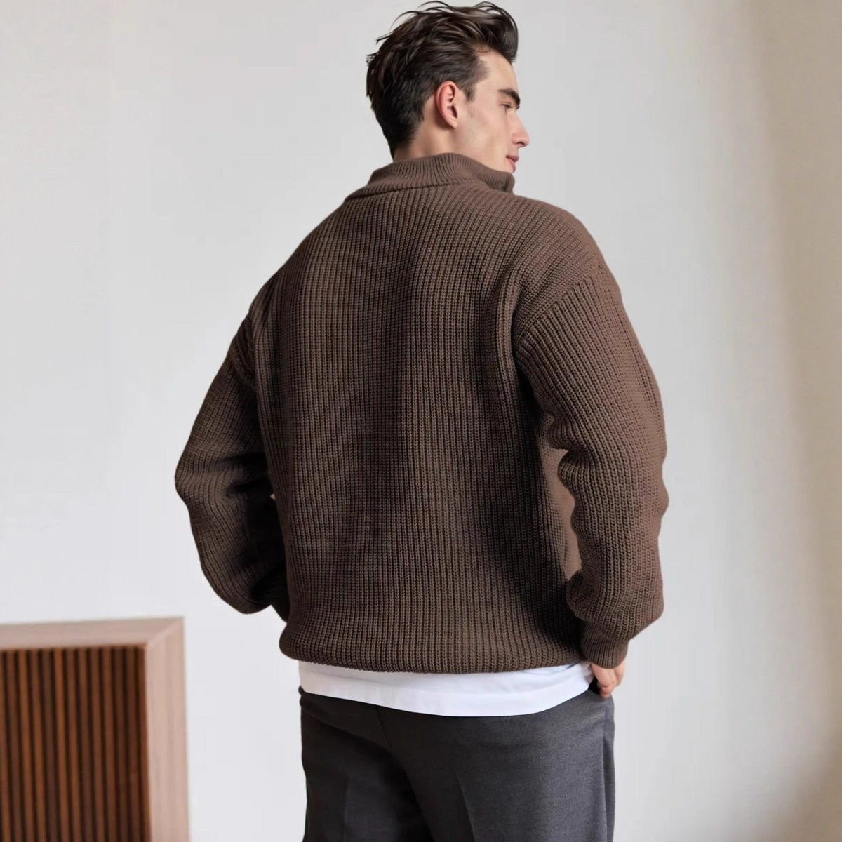 Back view of oversized brown ribbed knit jumper with high collar