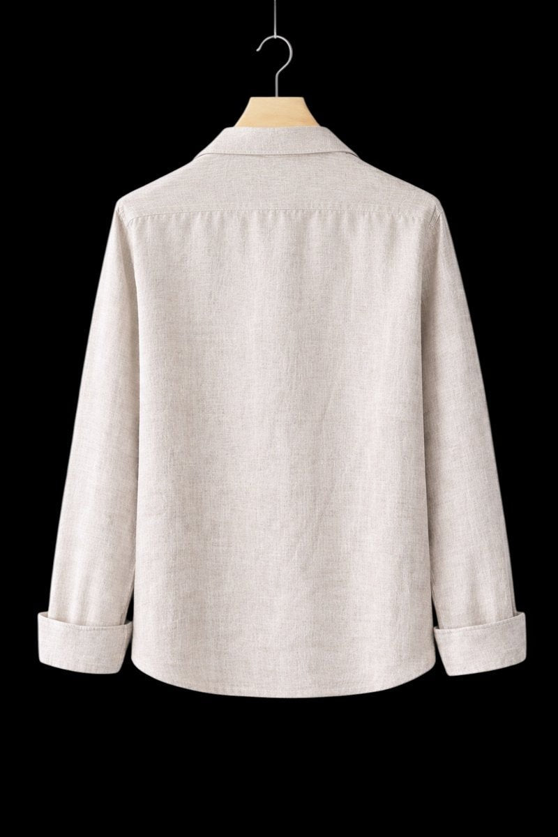 Rear view of beige linen shirt showing relaxed fit and rolled cuffs