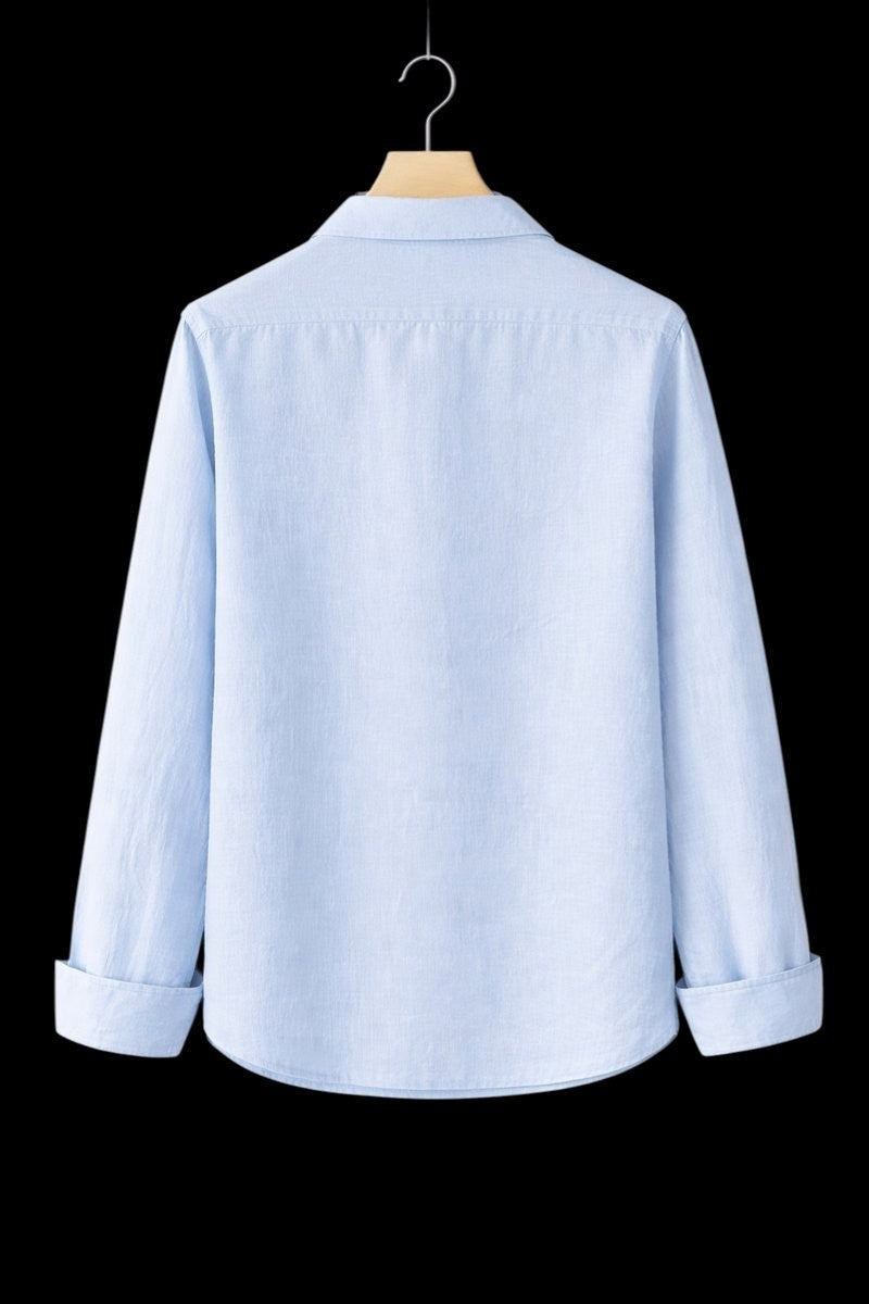 Light blue linen shirt viewed from behind, highlighting relaxed silhouette