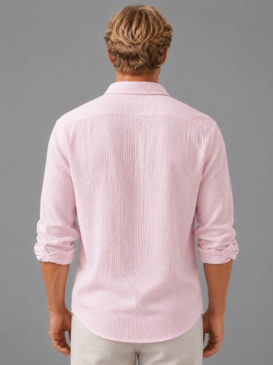 Rear view of pink crinkle-texture shirt with relaxed fit and long sleeves