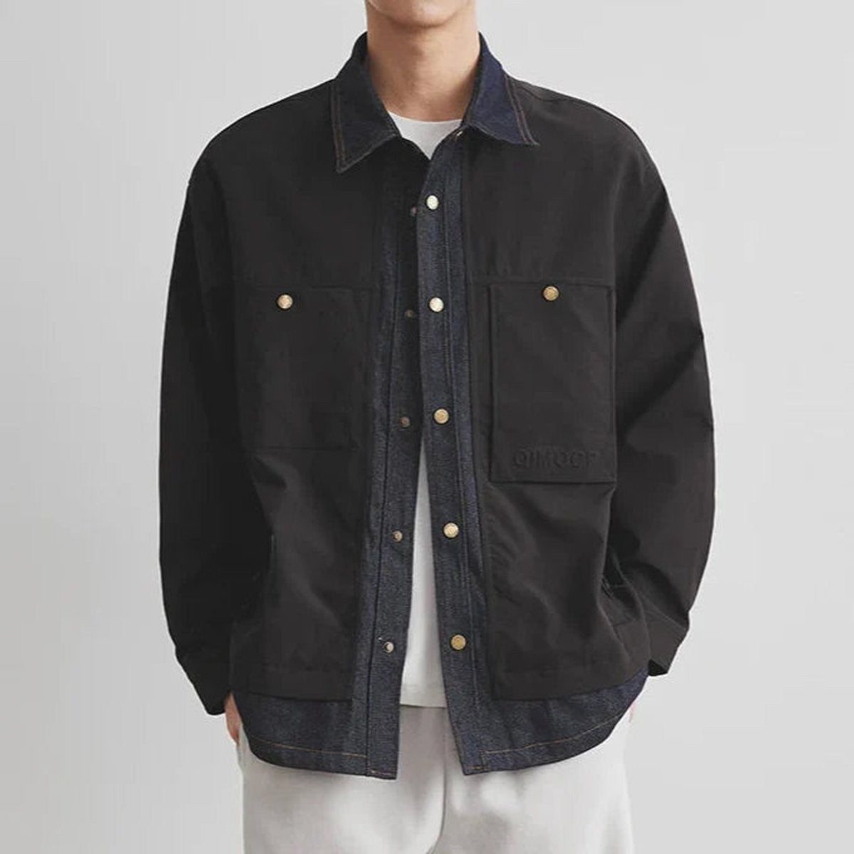 Black heavyweight canvas overshirt jacket with contrasting denim collar and popper fastenings