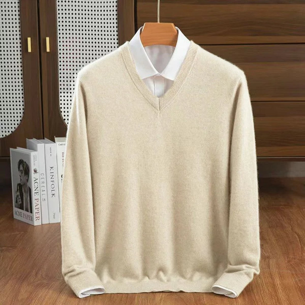 Beige V-neck knitted pullover styled with a crisp white shirt collar