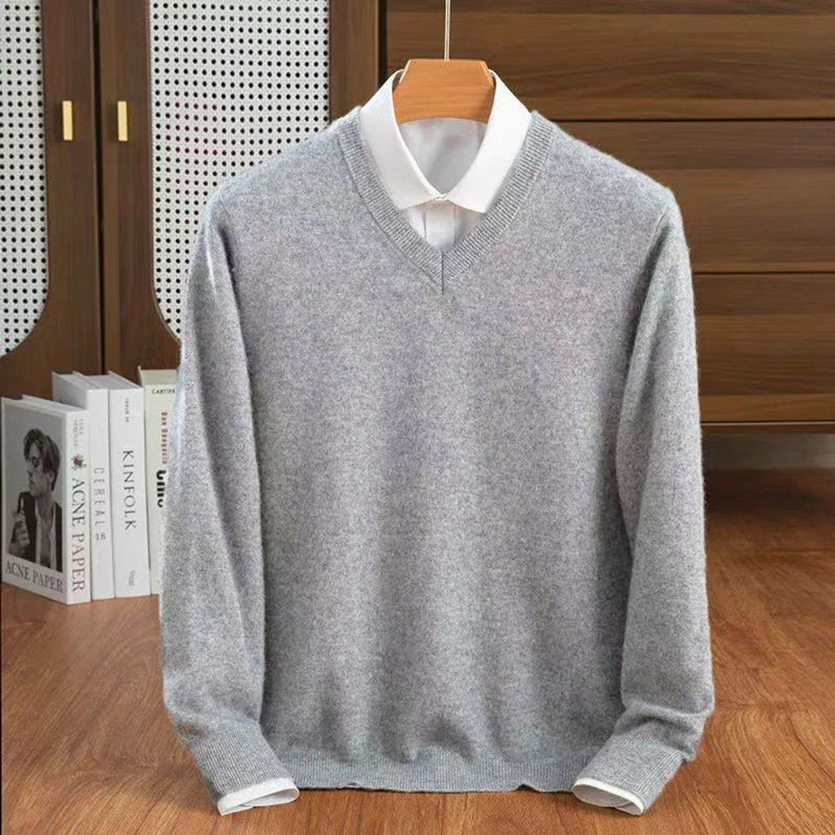 Light grey V-neck cashmere jumper paired with a white shirt underneath