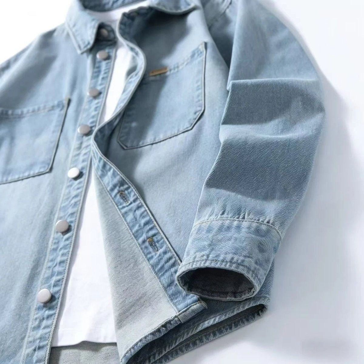 Light denim overshirt sleeve and pocket detail with contrast lining