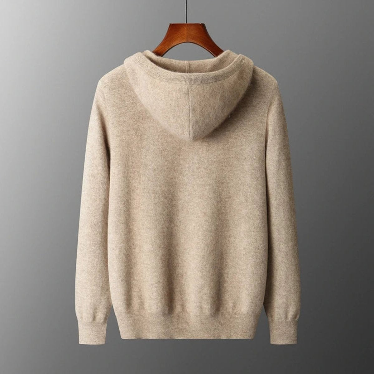 Rear view of oatmeal cashmere knit hoodie showing ribbed hood and hem