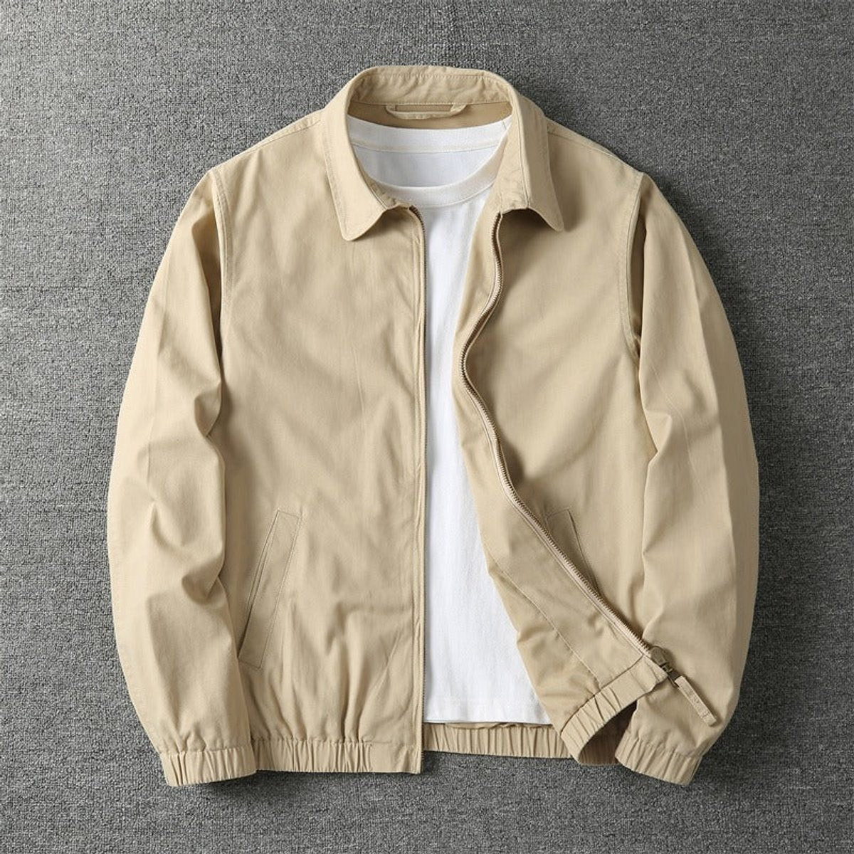 Beige lightweight bomber jacket with elasticated cuffs and full zip fastening