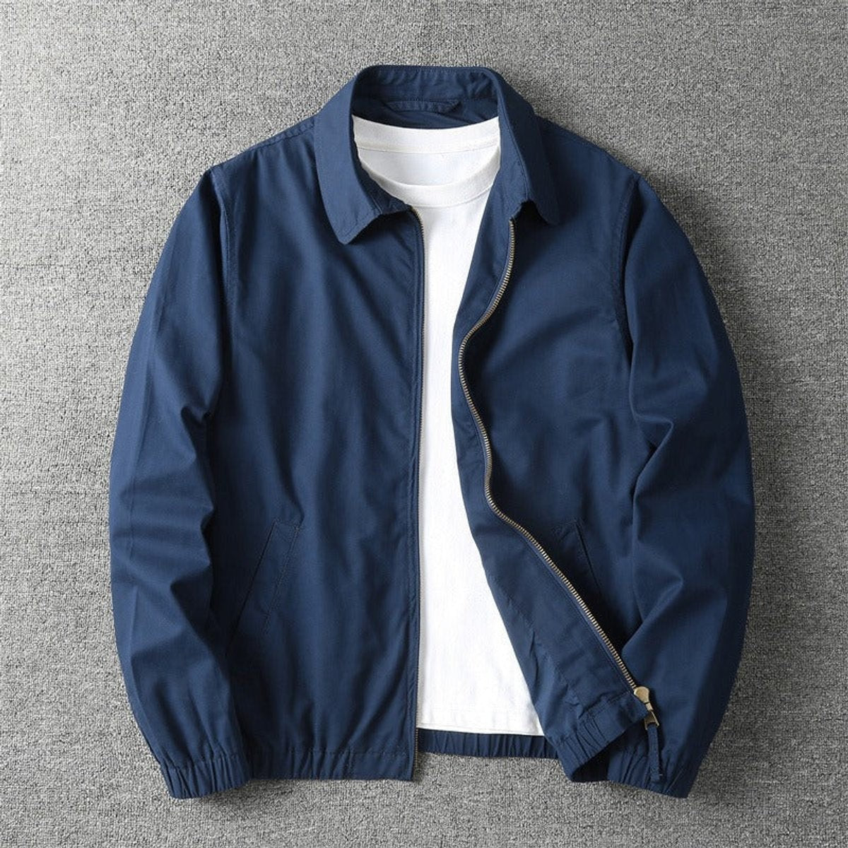 Navy lightweight bomber jacket with front zip and elasticated cuff detailing