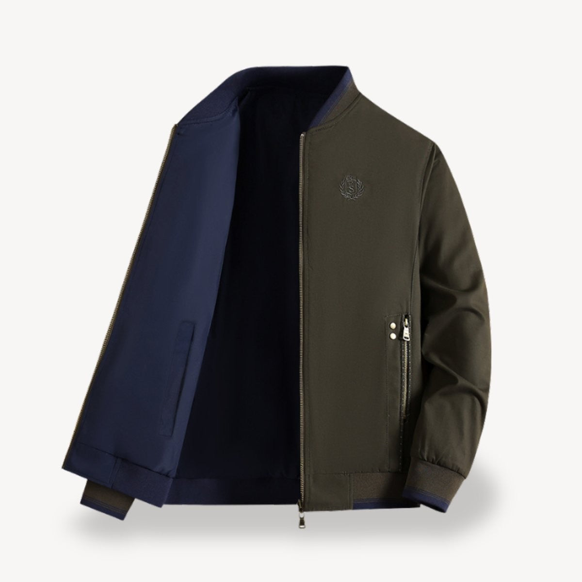 Khaki-green bomber jacket open to reveal navy reversible lining and ribbed cuffs
