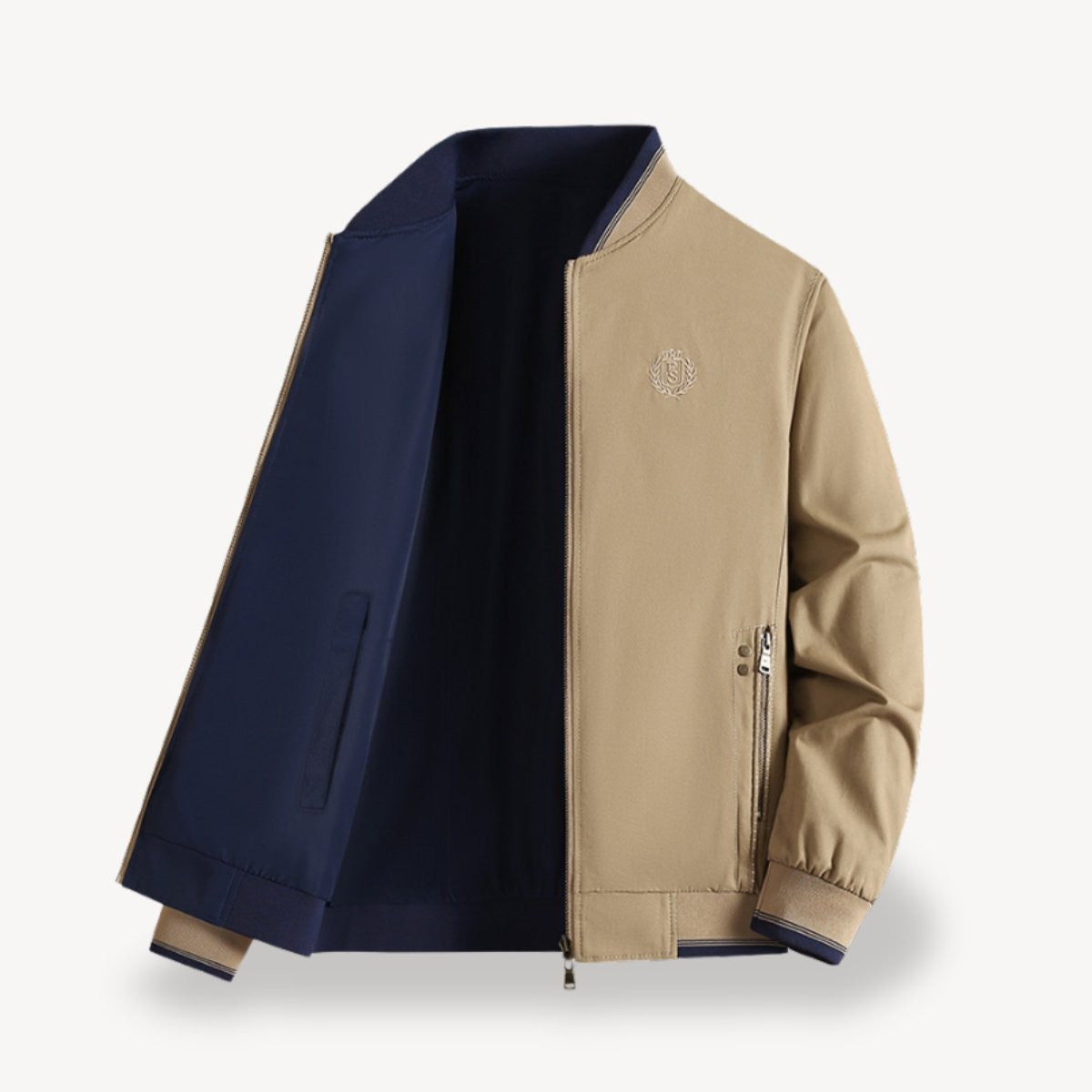 Beige bomber jacket open to reveal navy reversible lining and ribbed trims