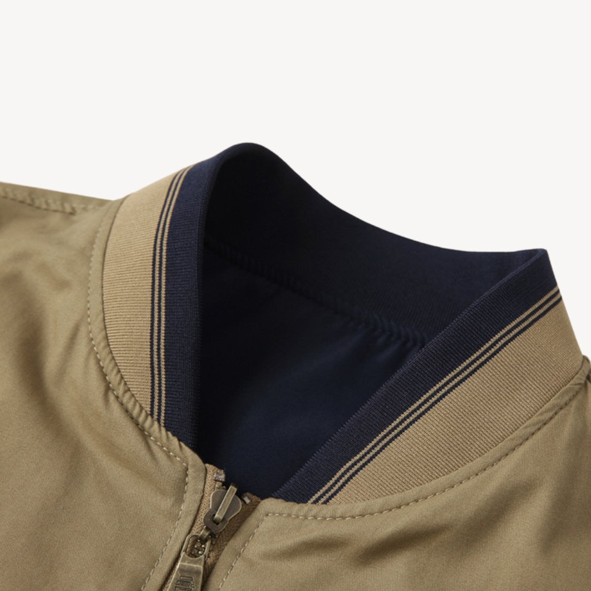 Close-up of striped ribbed collar showing navy and beige reversible fabric