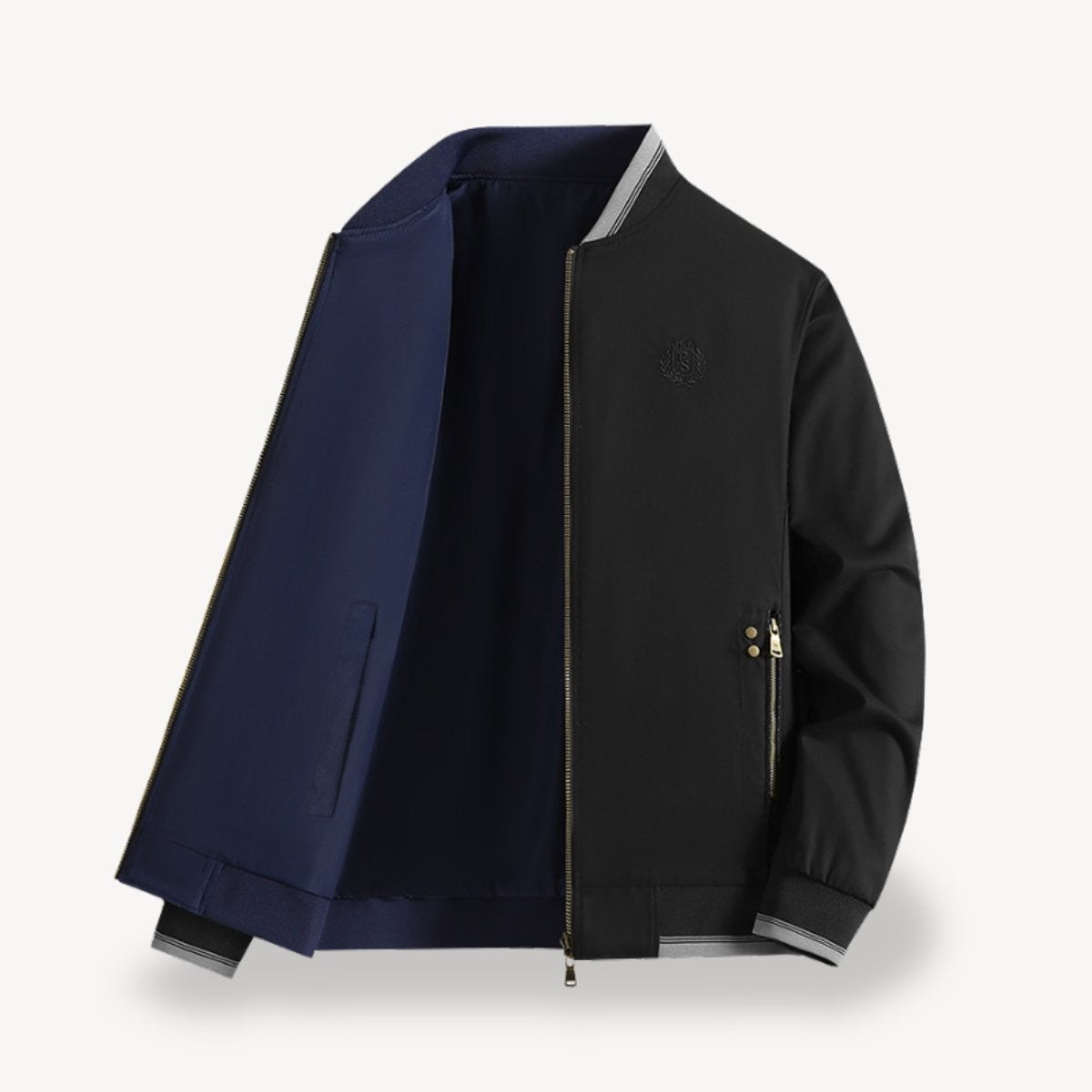 Black bomber jacket open to display navy reversible lining and striped trims