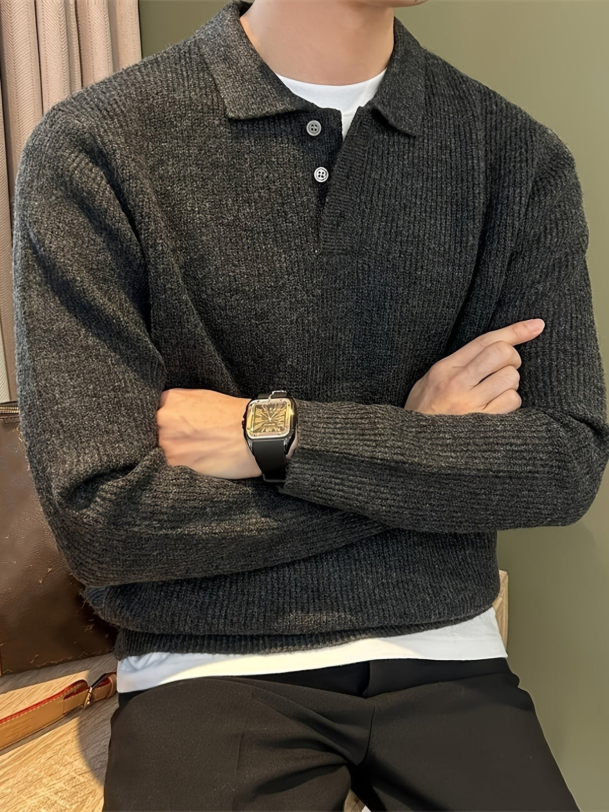 Charcoal ribbed polo sweater with button collar, paired with dark trousers