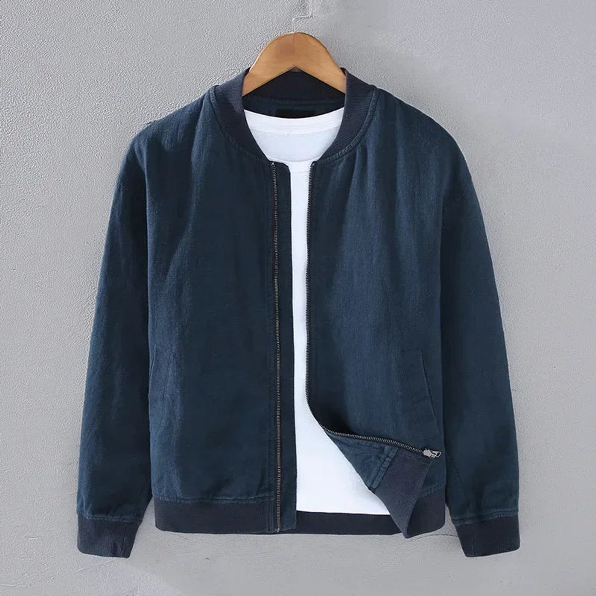 Navy zip-up bomber jacket with ribbed cuffs and collar detail