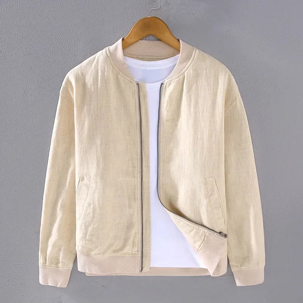 Beige zip-up bomber jacket with ribbed hem and slim fit