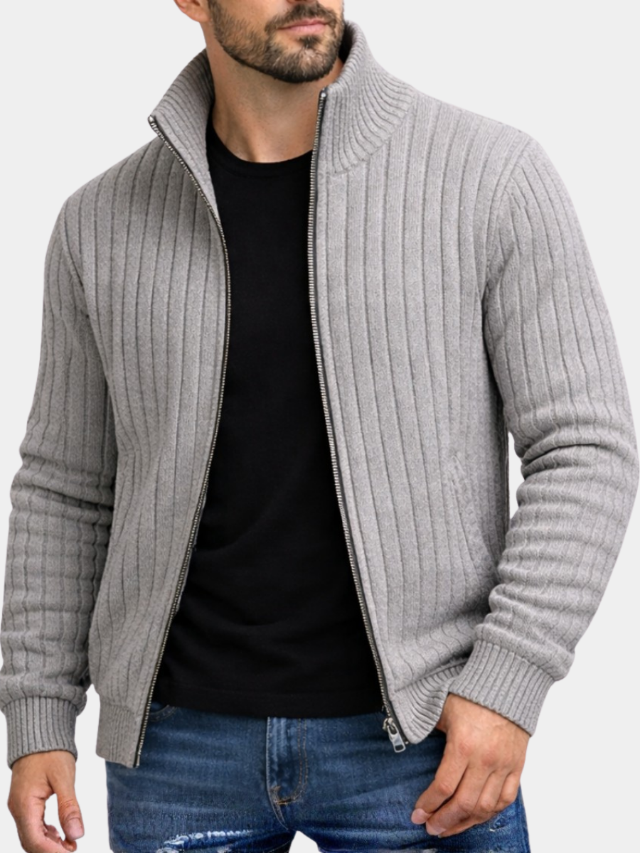 Grey ribbed knit zip cardigan with stand collar worn over black t-shirt