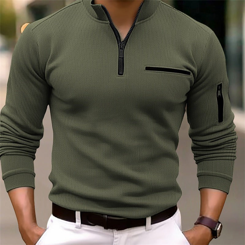 Olive green zip-neck top featuring ribbed knit and chest pocket detail