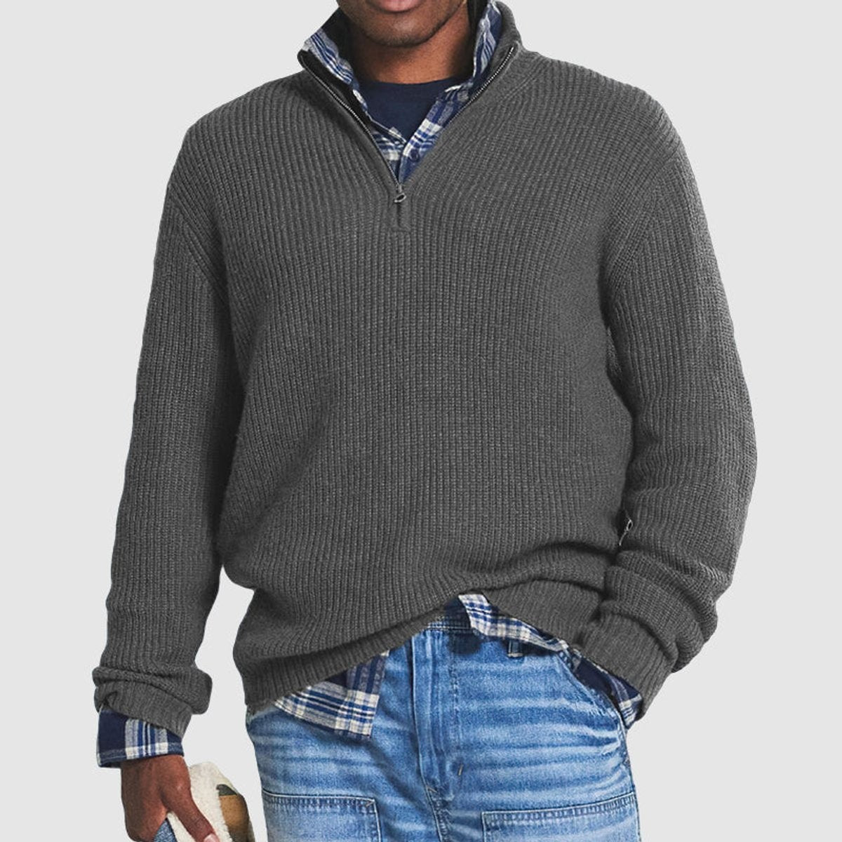 Charcoal grey ribbed knit quarter-zip jumper layered over checked shirt
