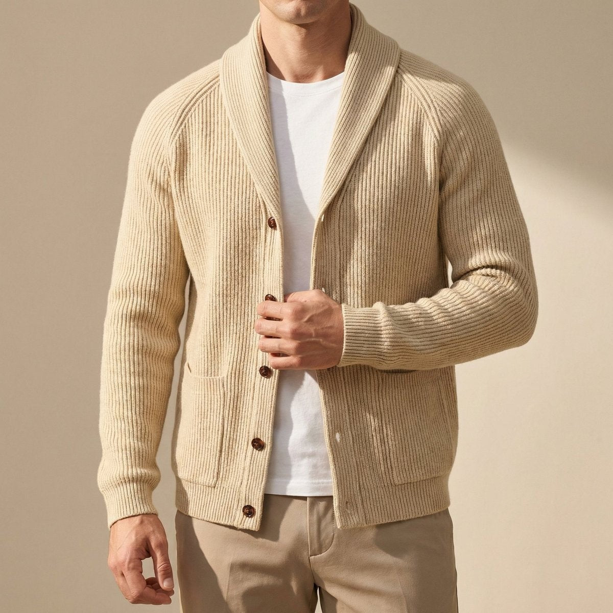 Beige ribbed wool cardigan with shawl collar and patch pockets, worn open