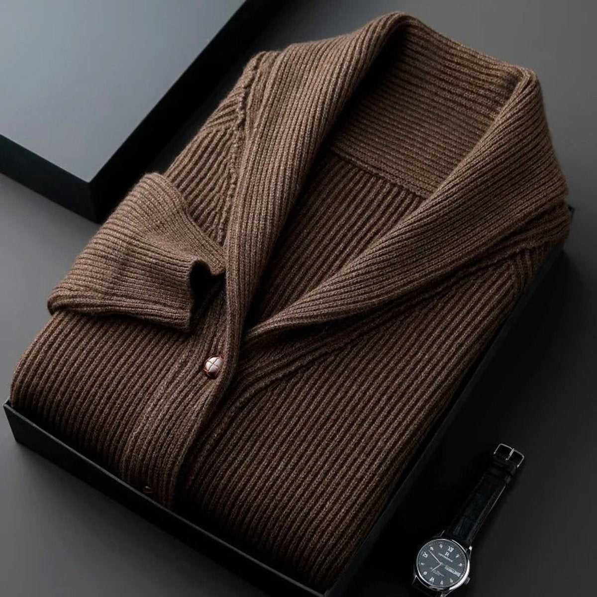 Folded brown ribbed knit cardigan with shawl collar shown in gift box
