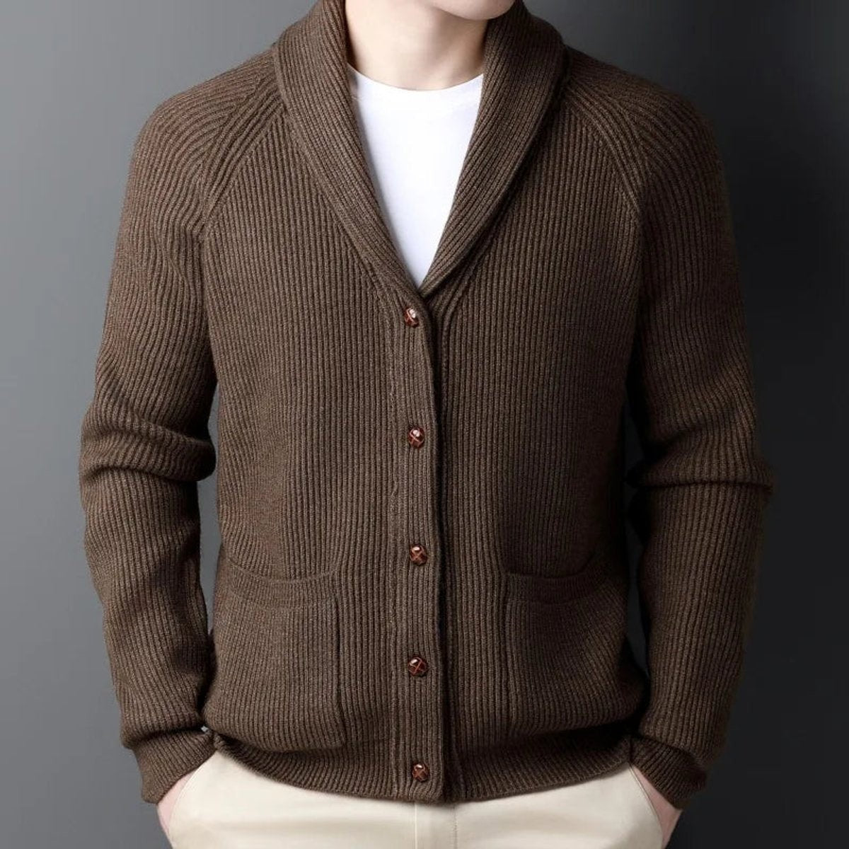Brown ribbed knitted cardigan featuring shawl collar and front patch pockets