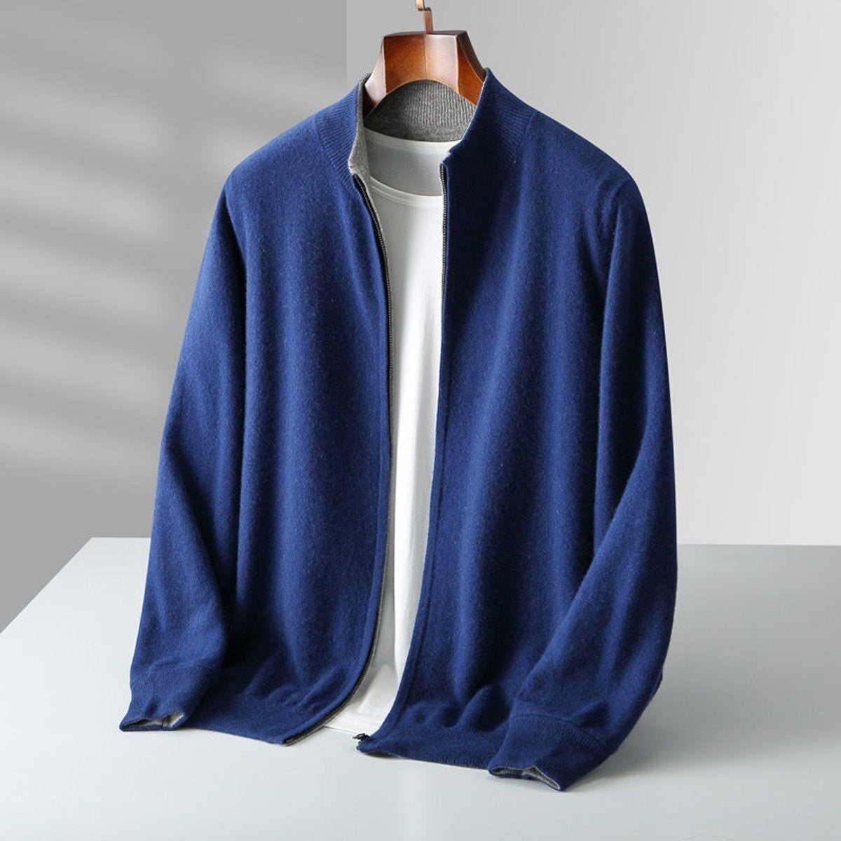 Navy blue knitted zip cardigan with contrast grey collar detail