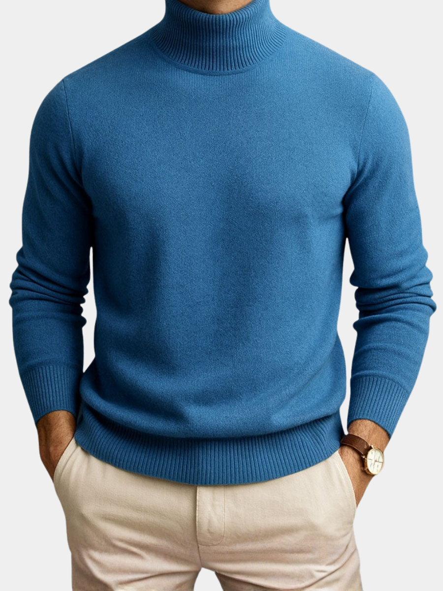 Men's blue roll-neck jumper paired with beige chinos, ribbed knit detailing