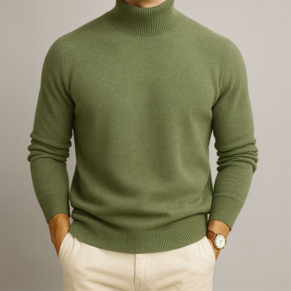 Olive green turtleneck jumper worn with cream trousers, fine knit texture