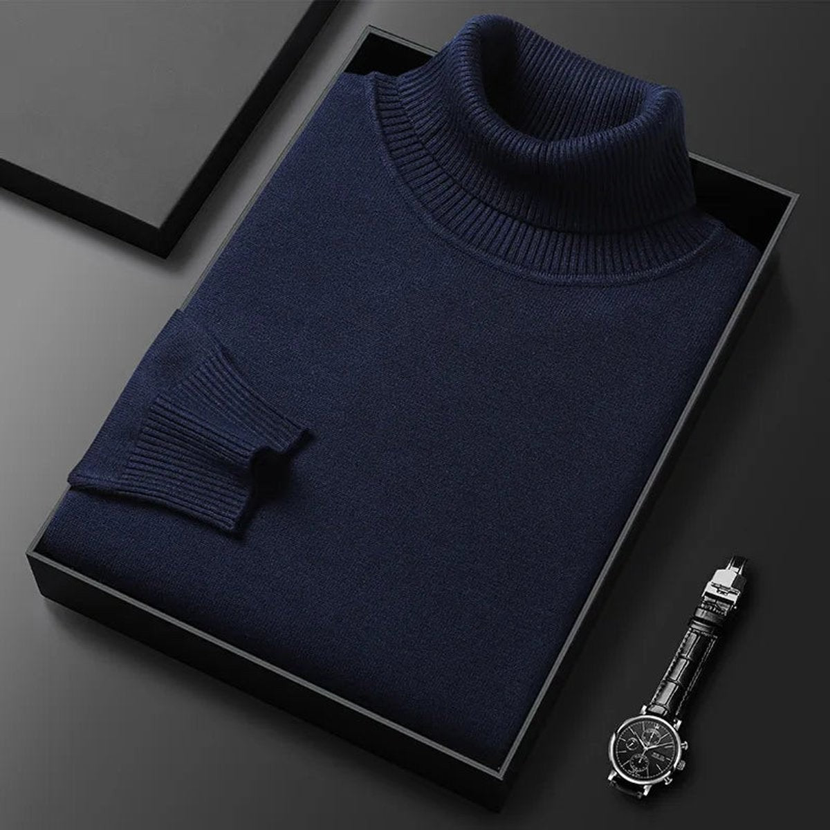 Navy ribbed turtleneck jumper folded neatly in black gift box