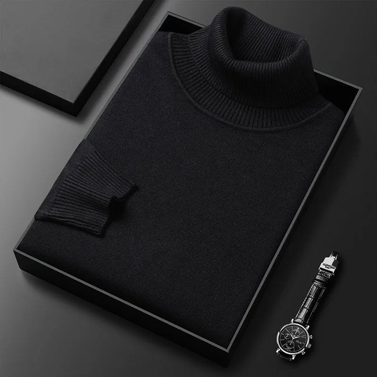 Black turtleneck jumper folded with ribbed cuffs and collar