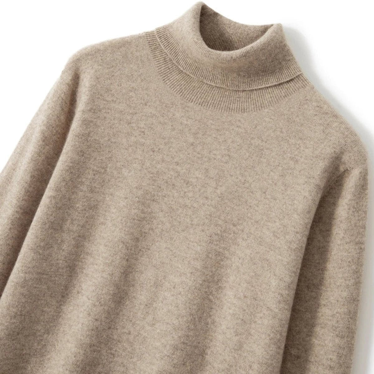Close-up of ribbed roll neck on beige merino wool turtleneck jumper