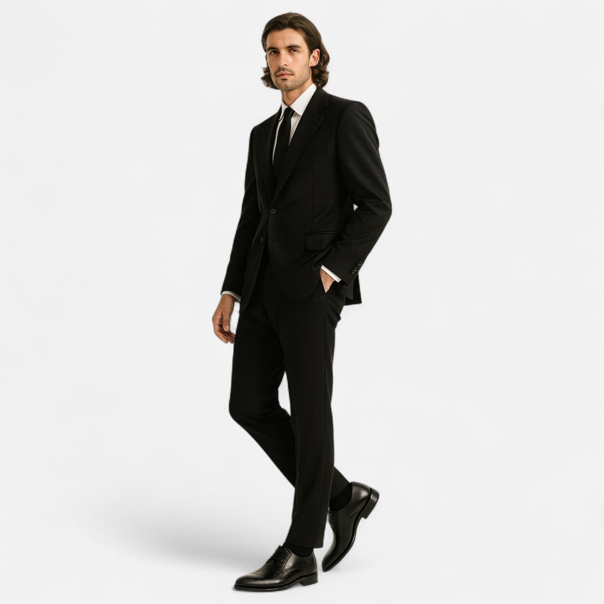 Man wearing tan lace-up derby shoes with dark trousers and beige jumper