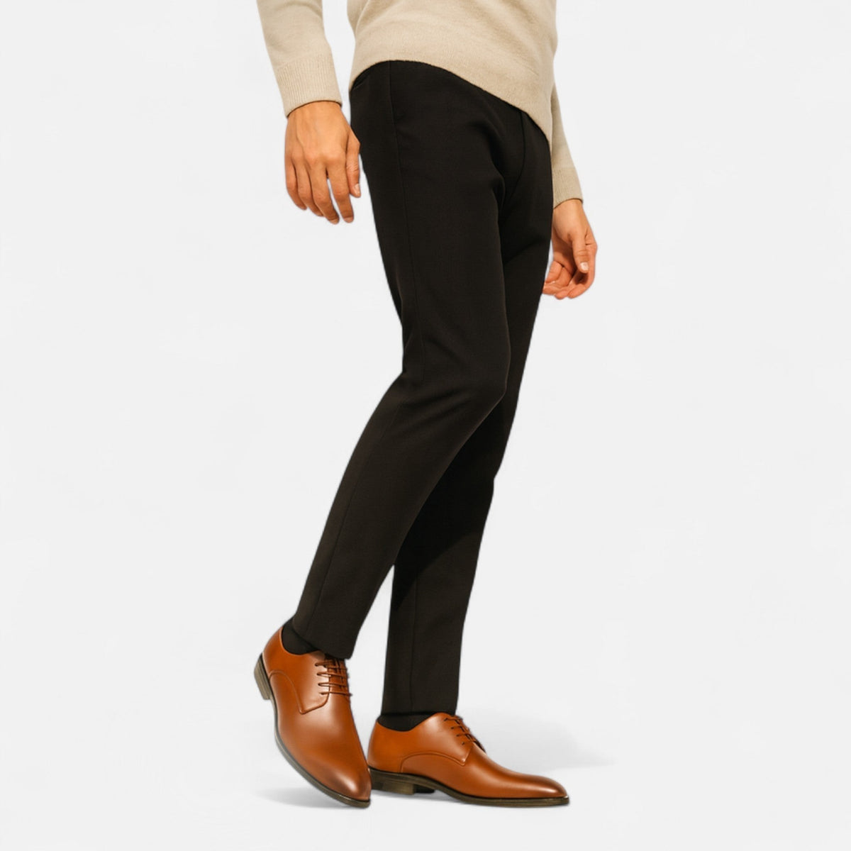 Man in black tailored suit paired with polished black lace-up shoes