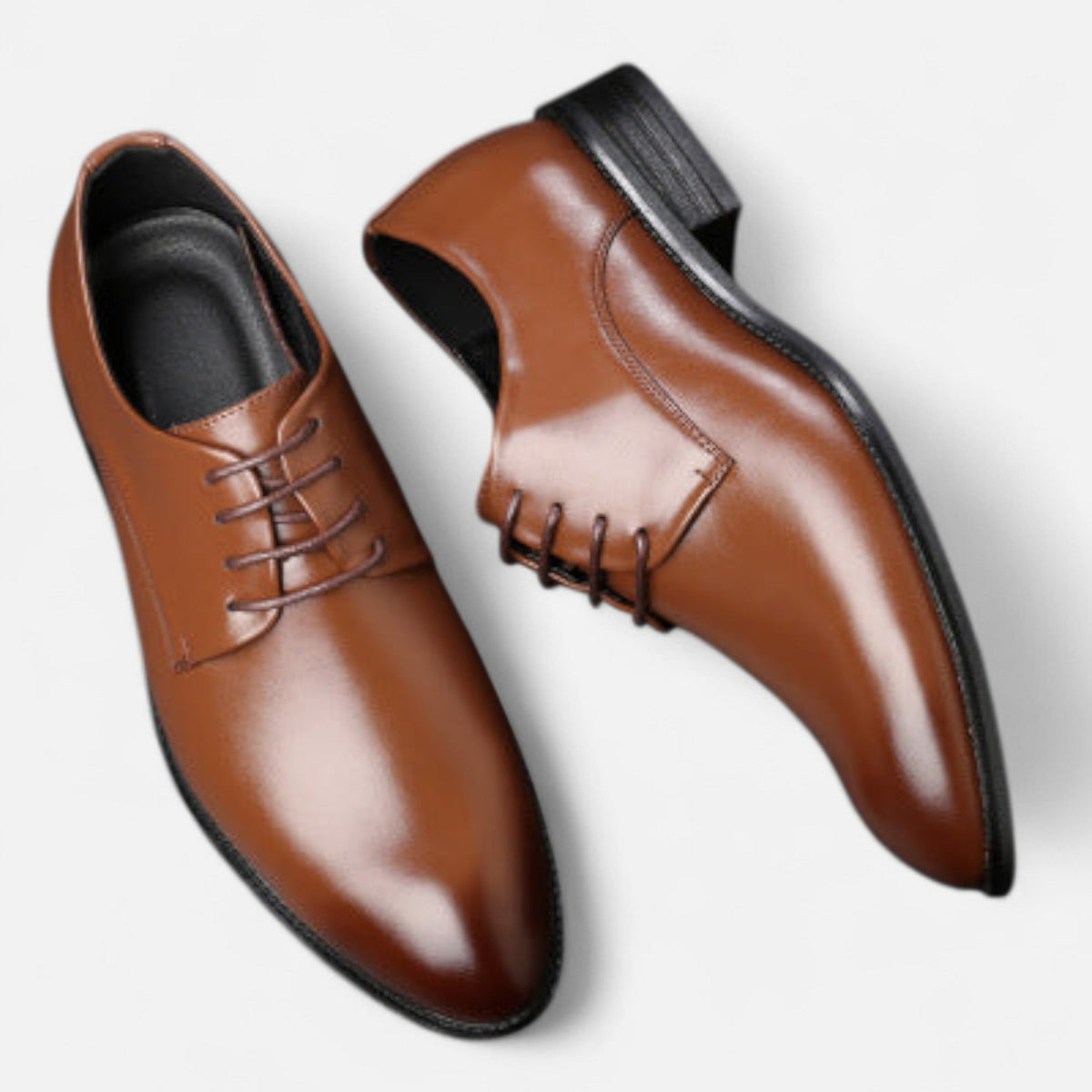 Model walking in brown leather lace-up shoes beneath black trousers