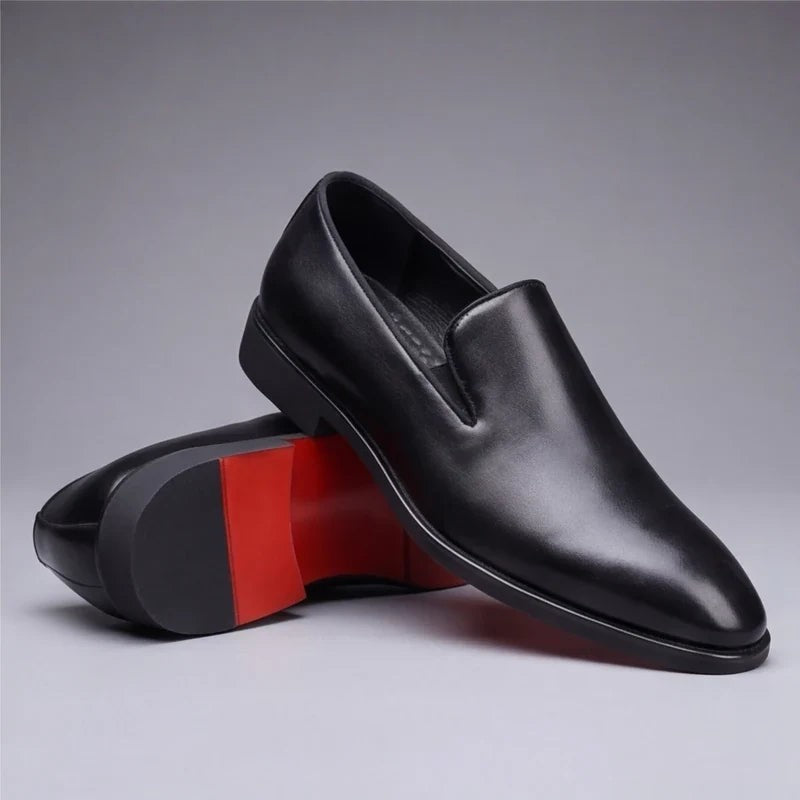 Black leather loafers with red sole shown from side angle