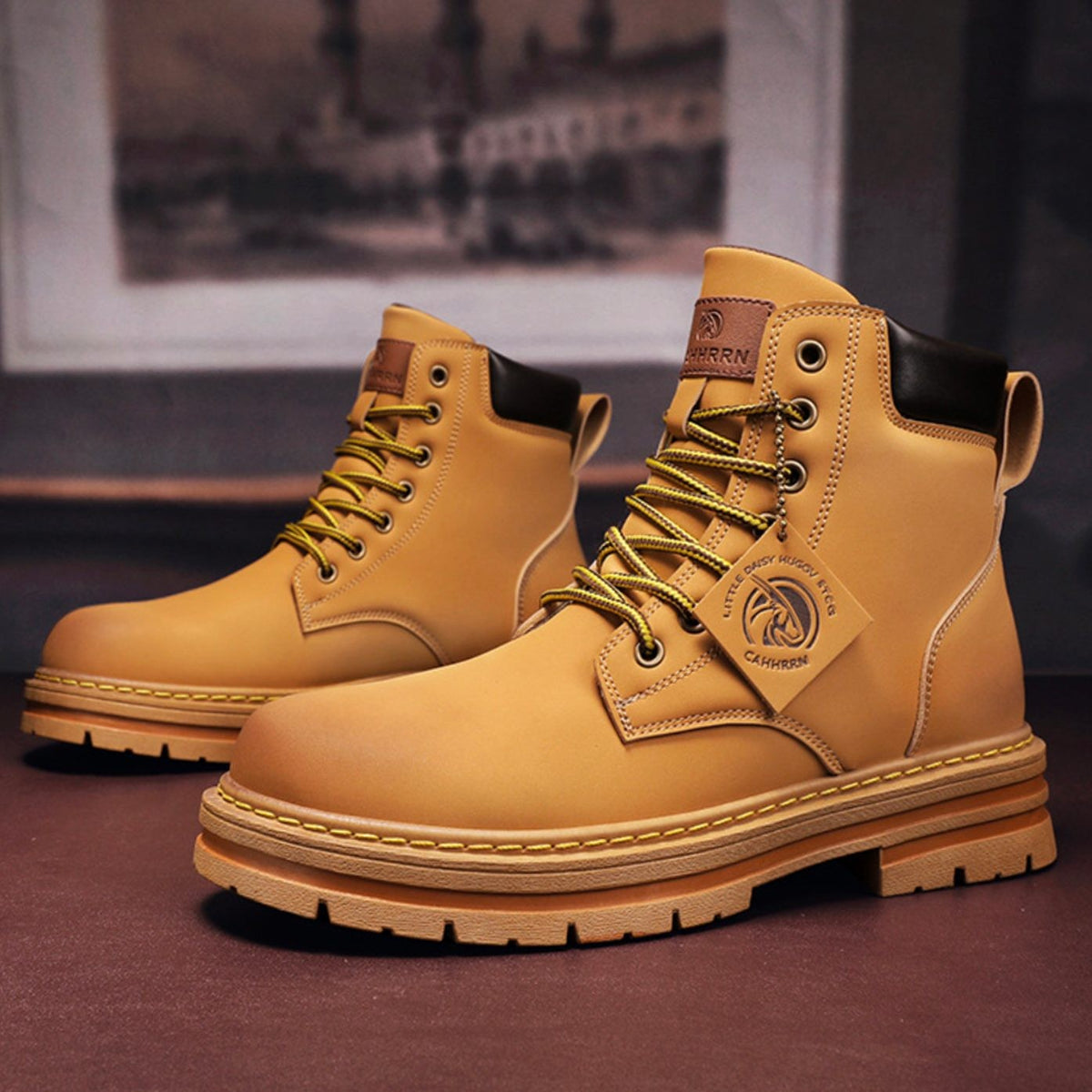 Tan leather lace-up work boots with contrast stitching and chunky rubber sole