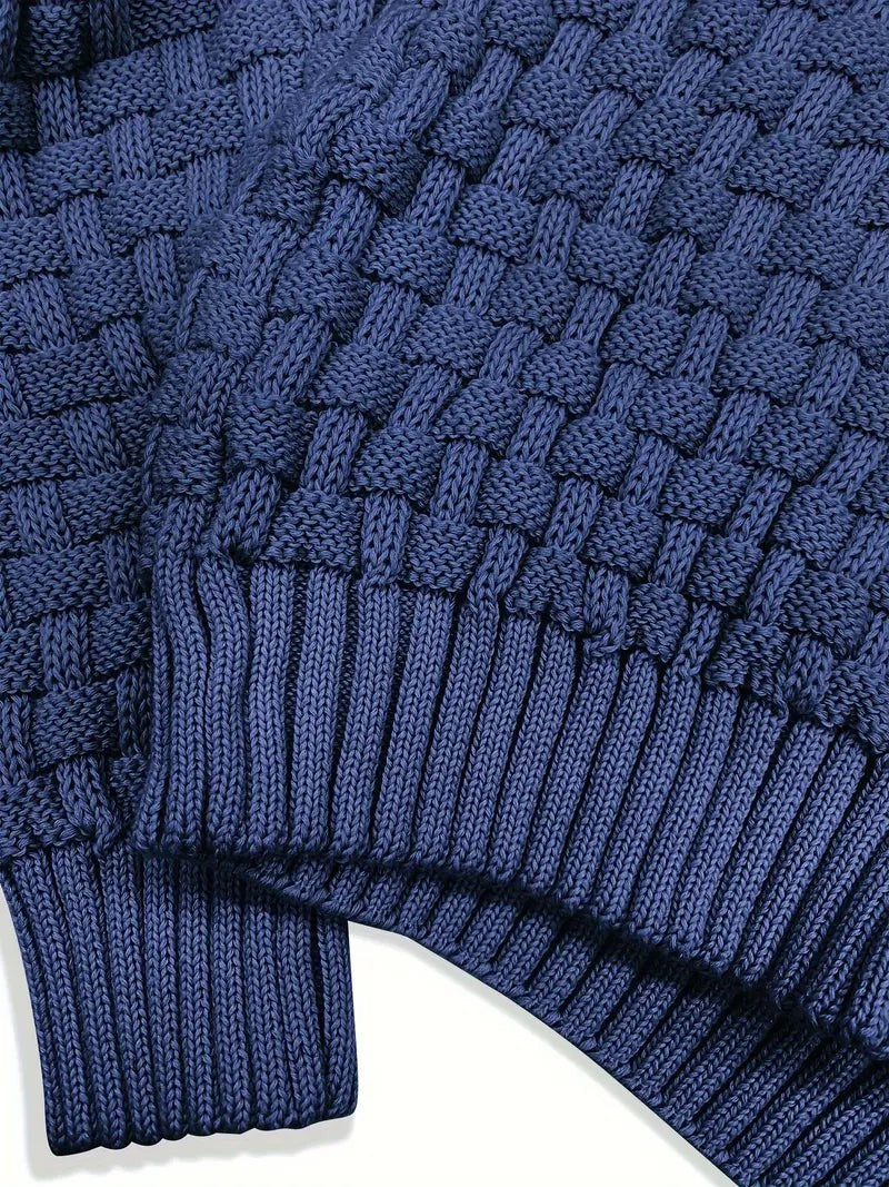Close-up of navy jumper cuff showing chunky basketweave knit