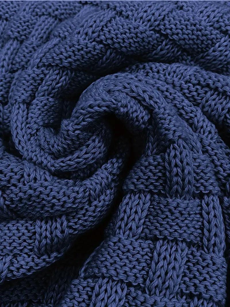 Detailed view of navy knit fabric texture on men's jumper