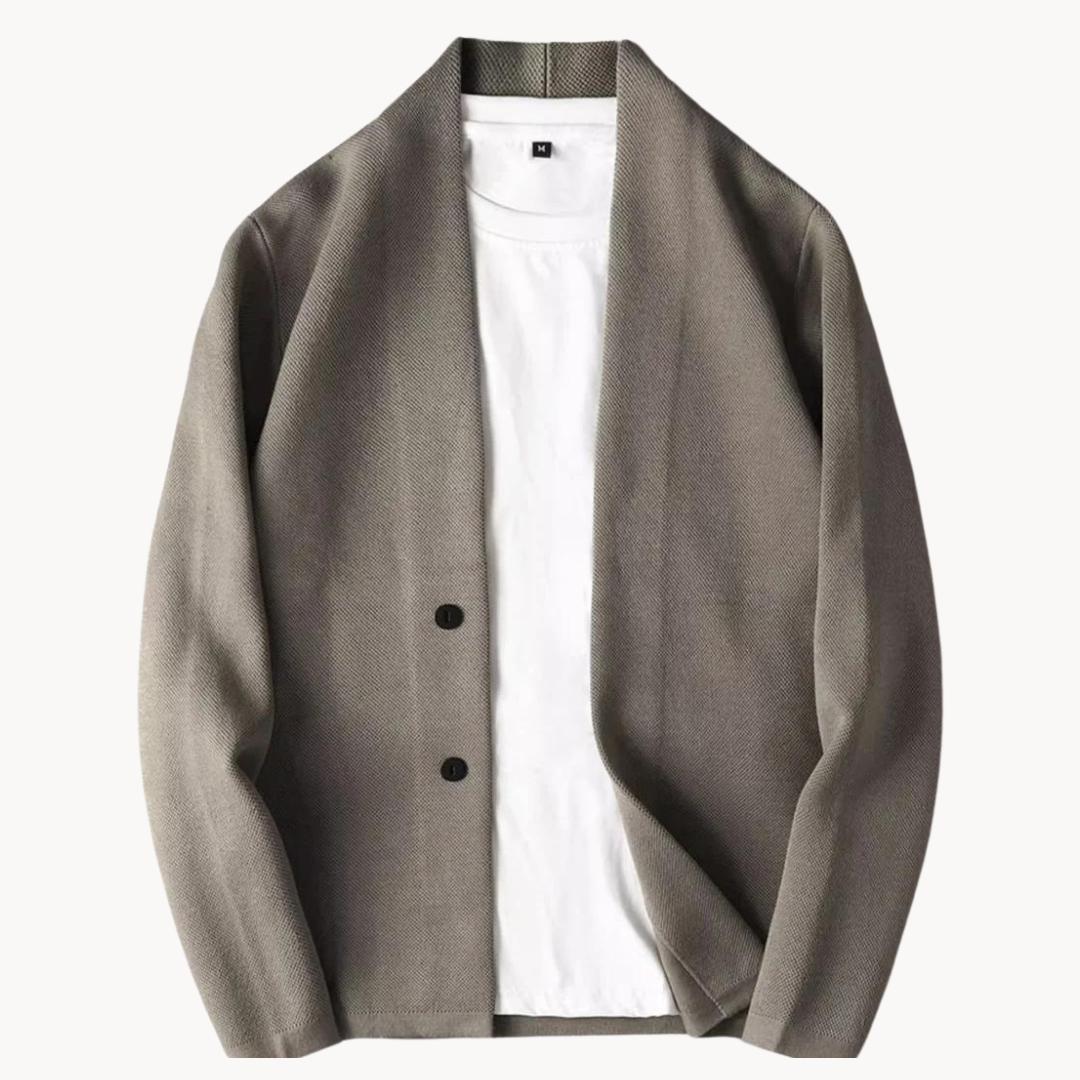 Grey collarless cardigan with two-button front, layered atop plain white tee
