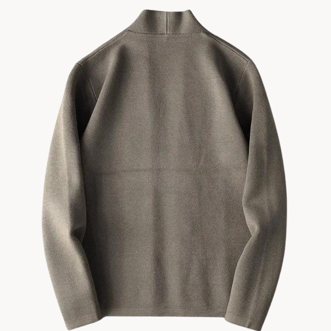 Rear view of taupe textured knit cardigan showing raised collar and seams