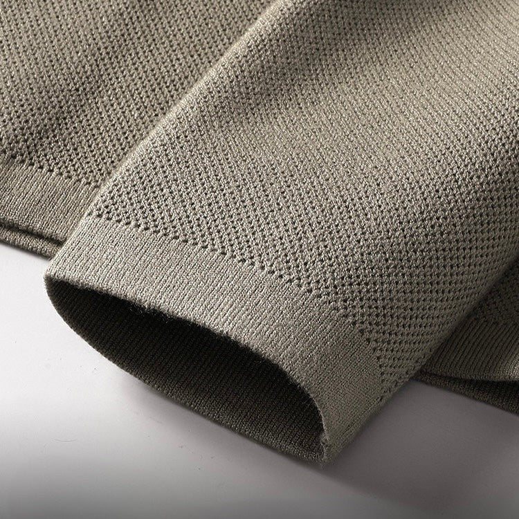 Close-up of taupe cardigan cuff showing ribbed knit fabric texture