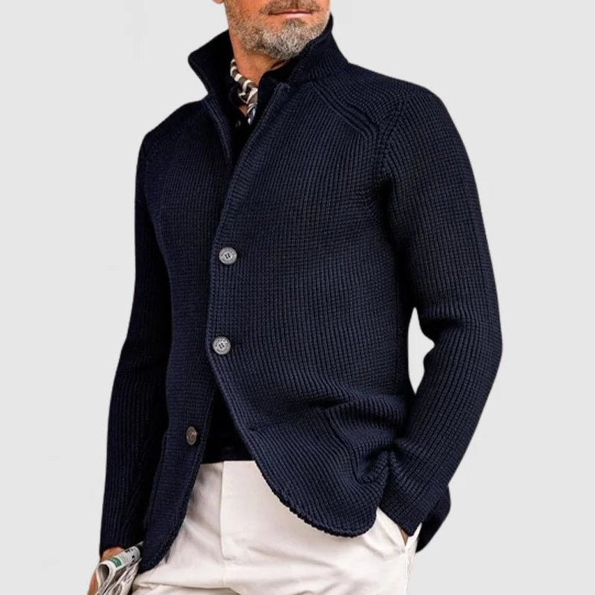Navy ribbed knit cardigan with stand collar, styled with white chinos