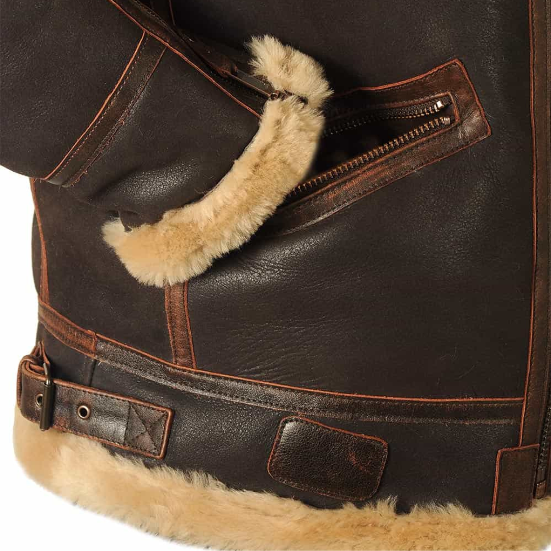 Detail of zip pocket with fur pull tab on brown leather aviator jacket