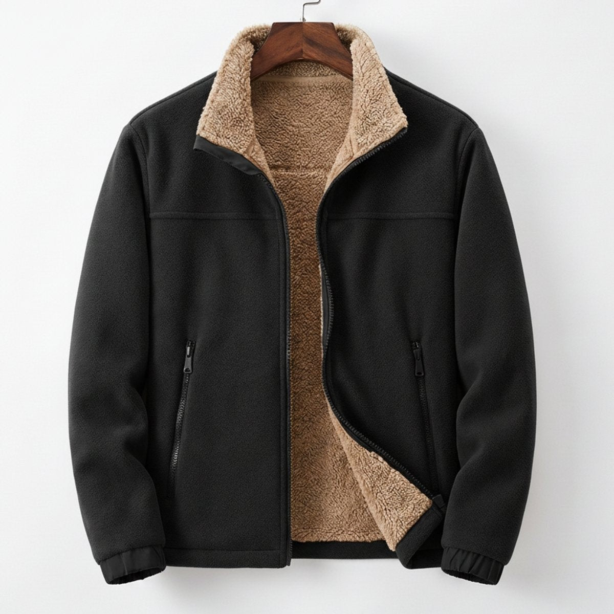 Black fleece zip-up jacket showing sherpa lining and zipped front pockets