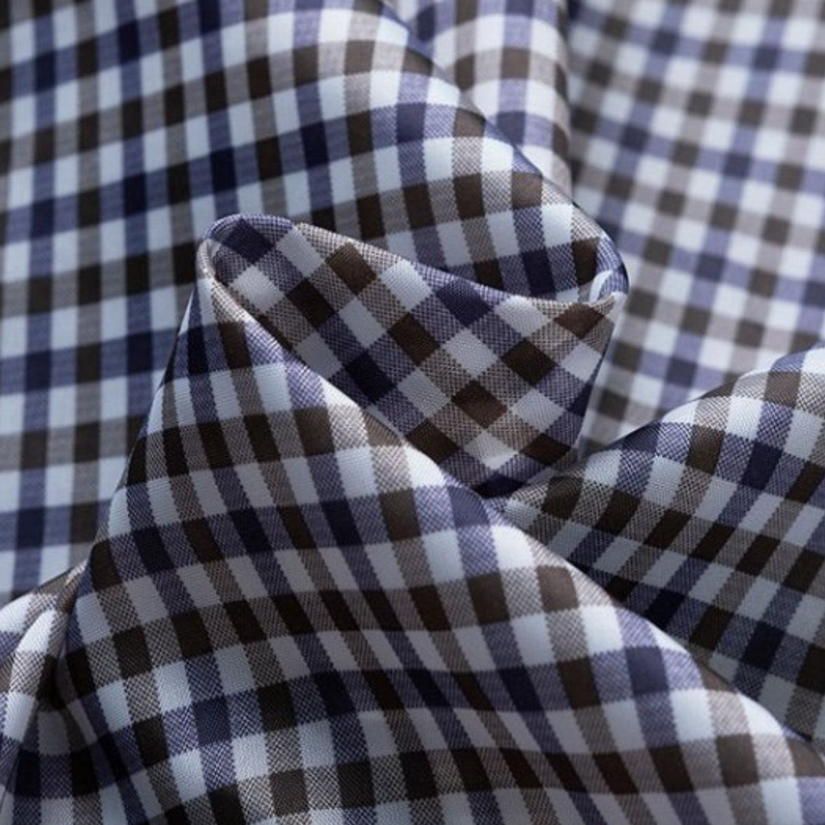 Close-up of navy and brown gingham check fabric used for jacket lining
