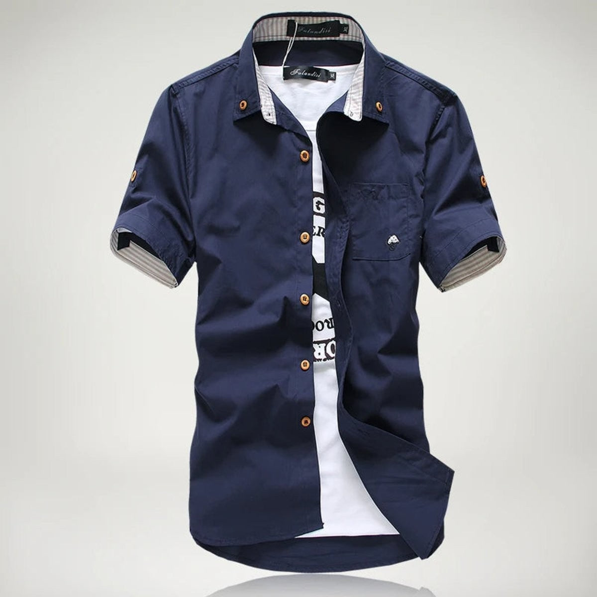 Navy short-sleeve shirt with striped placket, worn over white t-shirt