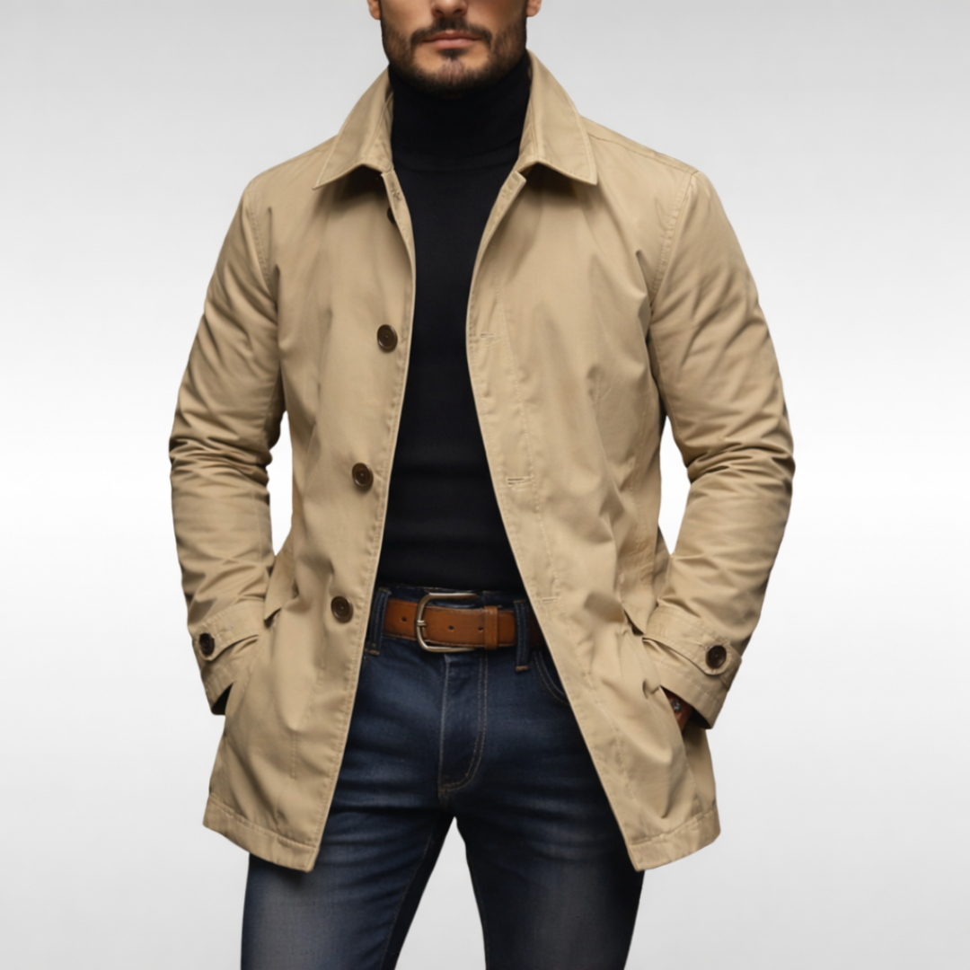 Beige mac coat with button front worn over black turtleneck