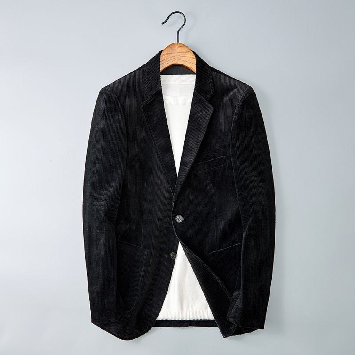 Black corduroy smart casual blazer featuring notched lapel and ribbed texture